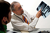 Doctor diagnosing a joint condition