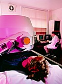 Person undergoing liver scan using a gamma camera