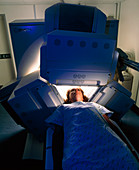 Woman's head being scanned by a gamma camera