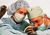Surgeon & assistant using endoscope