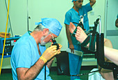 Surgeon examining patient's colon with colonoscope
