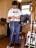 Man using home dialysis equipment
