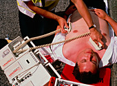 Ambulanceman treating heart attack patient