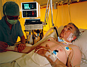 Nurse attending patient in ICU