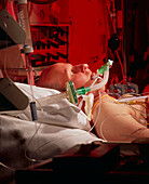 Man on respirator in cardiac intensive care