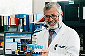 Pathologist holding blood samples