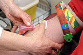 Removing blood sample needle