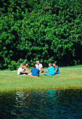 Group therapy session held on the bank of a river
