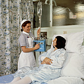 Nurse setting up an infusion pump