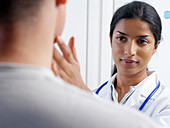 Doctor examining a patient