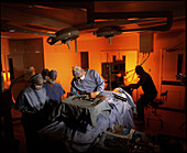 Surgical team performing a neck fusion operation