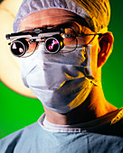 Surgeon with magnifying lenses for microsurgery
