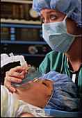 Anaesthetist administering anaesthetic gases