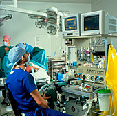 Anaesthetist monitoring the condition of a patient