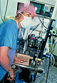 Anaesthetist monitoring anaesthetic equipment