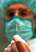 Surgeon holding a stent