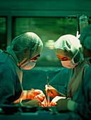 Surgical team conducting open heart surgery