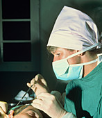 Nurse & surgeon during cometic surgery