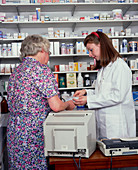 Pharmacist discusses prescription with a patient