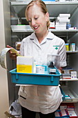 Pharmacist checking drugs labels