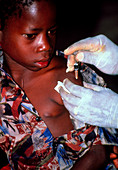 Child being vaccinated against malaria,Tanzania