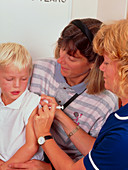 4-year-old boy receiving DPT booster vaccination