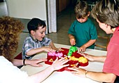 Children playing with toy in occupational therapy