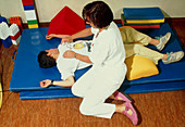 Physiotherapist with cystic fibrosis patient