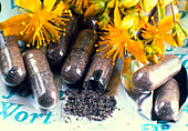 Pills and flowers of St John's wort,Hypericum sp