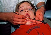 Girl (7 year old) undergoing a dental examination