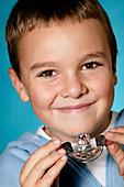 Young boy with a dental retainer