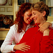 Lesbian couple,one of whom is pregnant
