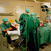Mum holding her baby after a caesarean section