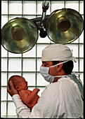 Man holding new-born baby