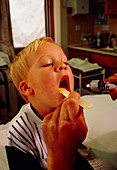 GP examining child's mouth