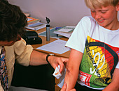 Doctor tending to a boy with a grazed elbow