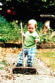 Boy using broom