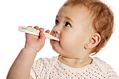 Baby brushing her teeth