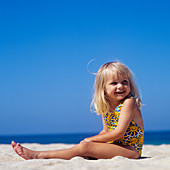 Girl playing on a beach