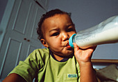 Baby boy bottle-feeding