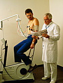 Man after taking stress test on exercise bicycle