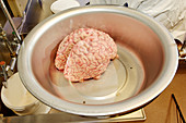 Human brain being weighed