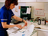 Health Centre nurse with minor surgery equipment