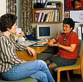Female GP doctor in consultation with a patient