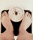 Woman's feet on a set of weighing scales