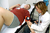 An overweight boy being examined