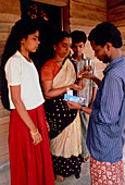 Health worker distributing anti-filarial drugs