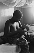 Woman breast-feeding in Tanzanian hospital
