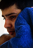 Man drying face with towel