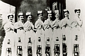 Nurses with lamps ready for night rounds,1899